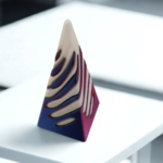 A modern, pyramid-shaped stress toy with blue, purple, and white horizontal ridges sitting on a clean white office surface.