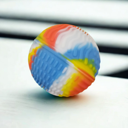 Close-up of a ZenSphere focus ball showing wavy and dotted textures for sensory relief.
